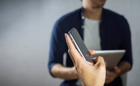 Man using phone over other studying