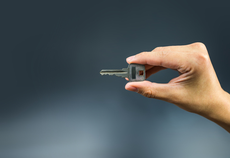 Key on hand holding to unlock gestureの写真素材