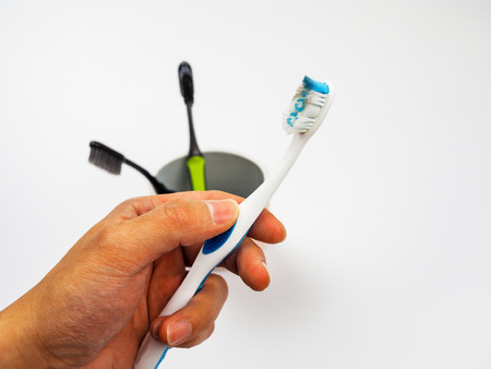 Used toothbrush on hand holdingの写真素材