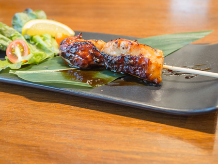 grilled chicken teriyaki sauce on plateの写真素材
