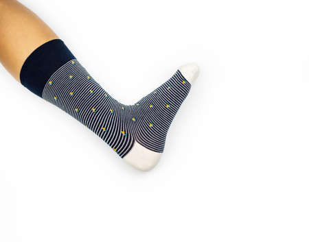Sock on leg, leg wearing sock one side on white backgroundの写真素材