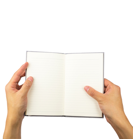 Empty opened notebook on hands holding isolated on white background, with clipping pathの写真素材