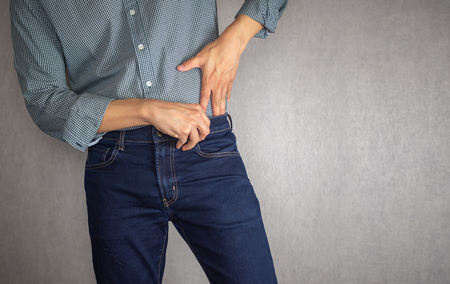 Tuck shirt into jeans close up