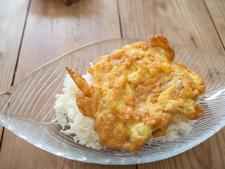 Thai egg omelet with boiled rice dishの写真素材