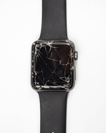 Bangkok, Thailand - August 24, 2018: Apple watch has a broken screen on the white table.のeditorial素材