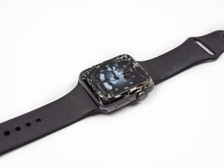 Bangkok, Thailand - August 24, 2018: Apple watch has a broken screen on the white table.のeditorial素材