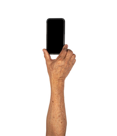 Phone holding by senior hand isolated on white backgroundの写真素材