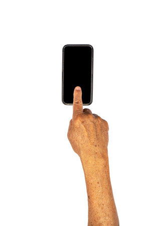 Senior hand clicking on empty black smart phone isolated on whiteの写真素材