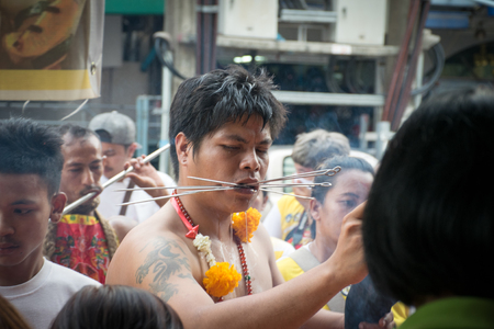 Hatyai, Songkhla, Thailand - Oct. 6, 2016 :  People celebrate a vegetarian festival during the festival ritual mortification is practised to appease the Gods.Action photography Capturing movement.のeditorial素材