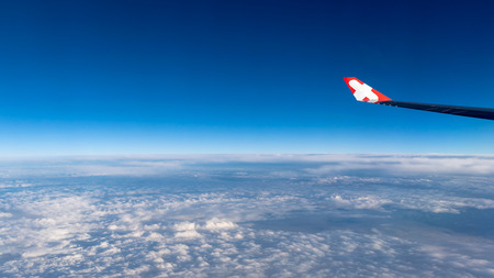 View of the clouds and airplane wing from the Insideの写真素材