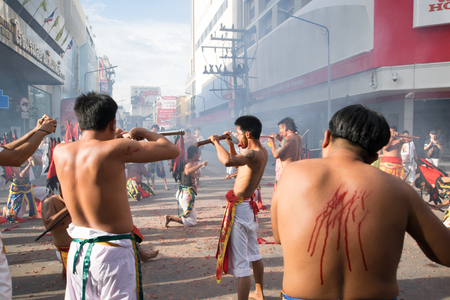 Hatyai, Songkhla, Thailand - Oct. 7, 2016 :  People celebrate a vegetarian festival during the festival ritual mortification is practised to appease the Gods.Action photography Capturing movement.のeditorial素材