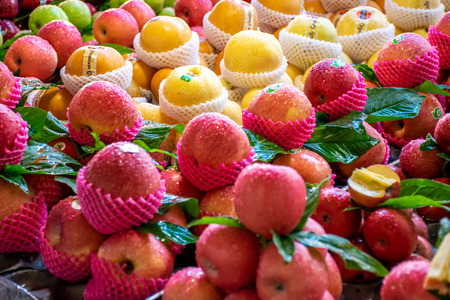 Songkhla, Thailand, Apr. 21, 2018 : Fresh fruits with water drops for sales in the Kim Yong market, Hatyai, Songkhla, Thailand.の写真素材