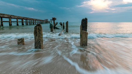 Old stone bridge  into the sea.の写真素材
