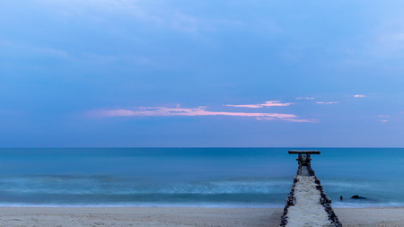 Old stone bridge  into the sea.の写真素材