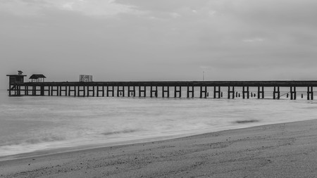 Old stone bridge  into the sea.の写真素材