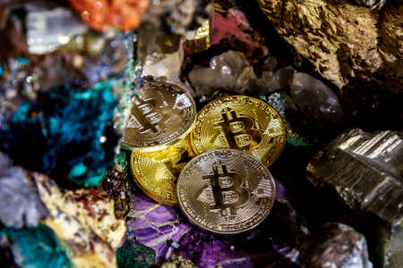 Silver and golden bitcoin in a cave of precious stones. Bitcoin cryptocurrency.の写真素材