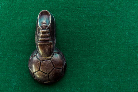 Soccer concept. Football, soccer ball with old soccer cleatの写真素材