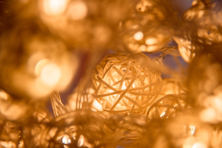 Close up glow garland on orange backgroundの写真素材