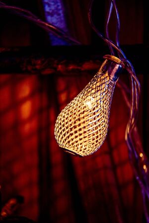 Close up glow garland on wood backgroundの写真素材