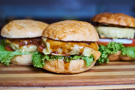 Two hamburgers on a wooden board. Close-up.の写真素材