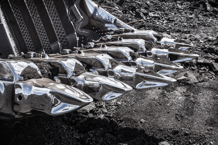 Excavator digging a deep trenchの写真素材