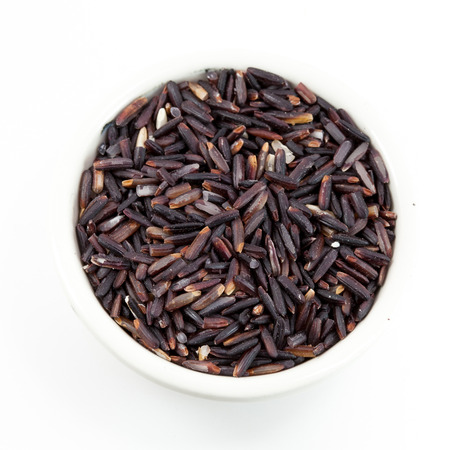 rice berry in bowl on white backgroundの写真素材