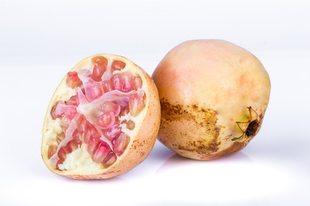 Ripe pomegranates isolated on a white background