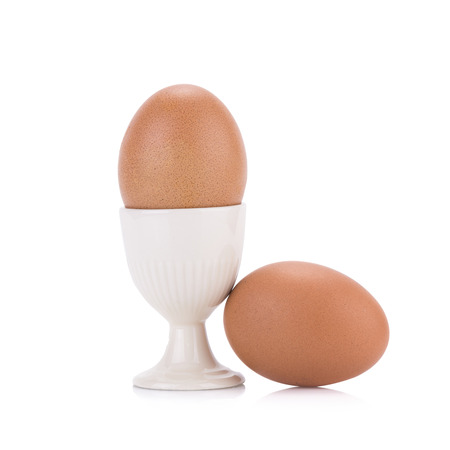 Close up of an egg isolated on white background.の写真素材