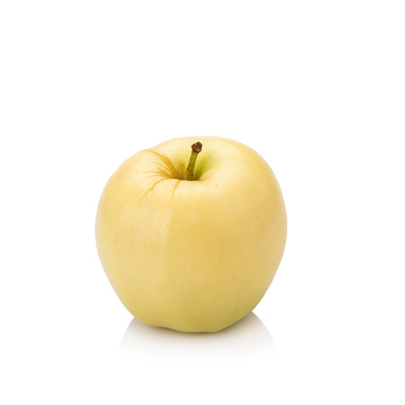 ripe yellow apple isolated on white.の写真素材