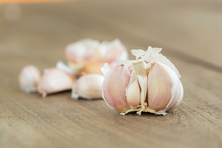 Fresh Garlic on the Wooden Table. Selective focus.の写真素材