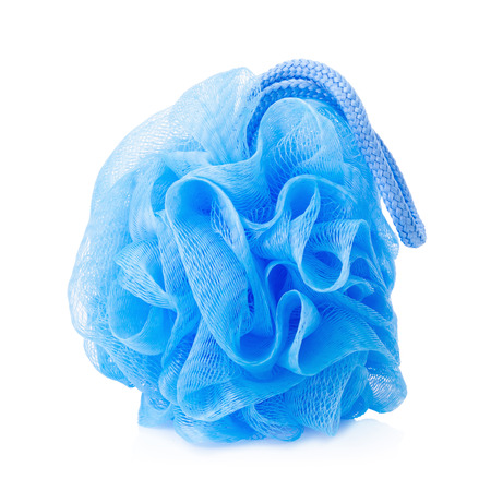 Blue plastic bath puff isolated on white background.の写真素材