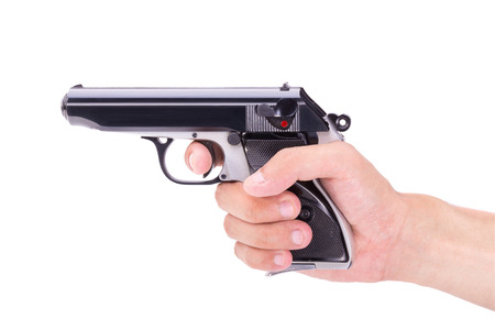 White hand holds gun isolated on white background.