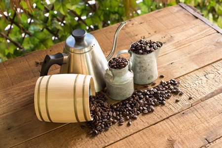 Roasted coffee beans on a wood floor for decoration.の写真素材