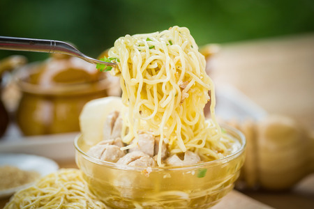 pork meatballs and noodle soup.の写真素材