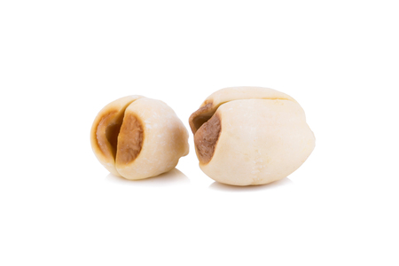Dried lotus seeds on white background.の写真素材