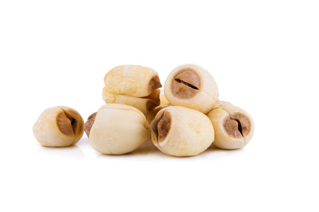 Dried lotus seeds on white background.の写真素材