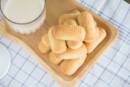 Pineapple cookies whit a glass of milk.の写真素材