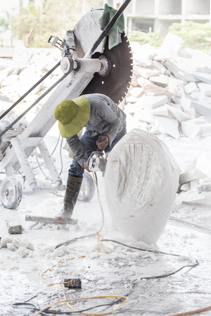 sculptor makes a sculpture of white marbleの写真素材