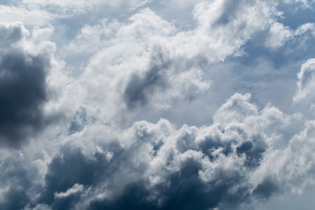 Dark gray and black clouds with some interesting light.の写真素材