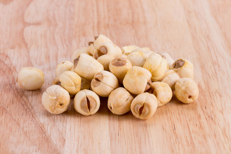 Close up Lotus seeds on wooden tableの写真素材