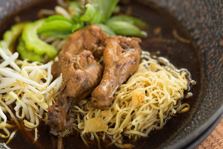 Chicken noodle soup on wooden tableの写真素材