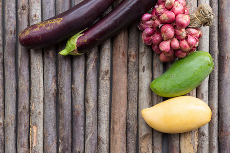 Fruits and vegetables on the wooden floorの写真素材
