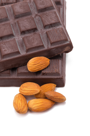 Almonds and dark chocolate isolated on white backgroundの写真素材
