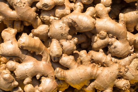 Fresh ginger at a market stall. Selective focus