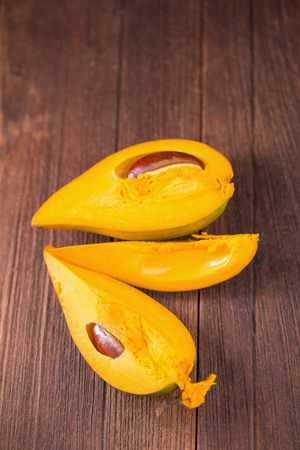 Egg fruit Canistel Yellow Sapote (Pouteria campechiana (Kunth) Baehni) on dark background
