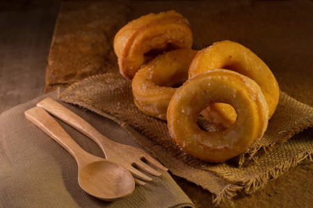 Donuts with sugar on a dark background. Selective focus.