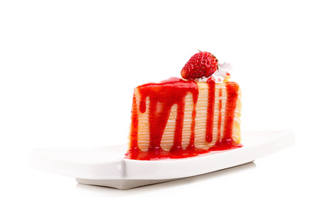 strawberry crepes cake with strawberry sauce on white background.の写真素材