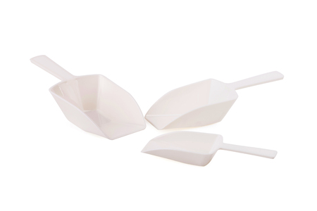 Empty white plastic scoop isolated over white background.の写真素材