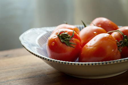 Slices of tomatoes. Chopped tomatoes.Fresh tomatoes Healthy food concept. Close up. Selective focus.の写真素材