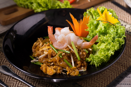 Fried noodle Thai style with prawns Stir fry noodles with shrimp in Pad Thai Thai noodle style Traditional foodの写真素材
